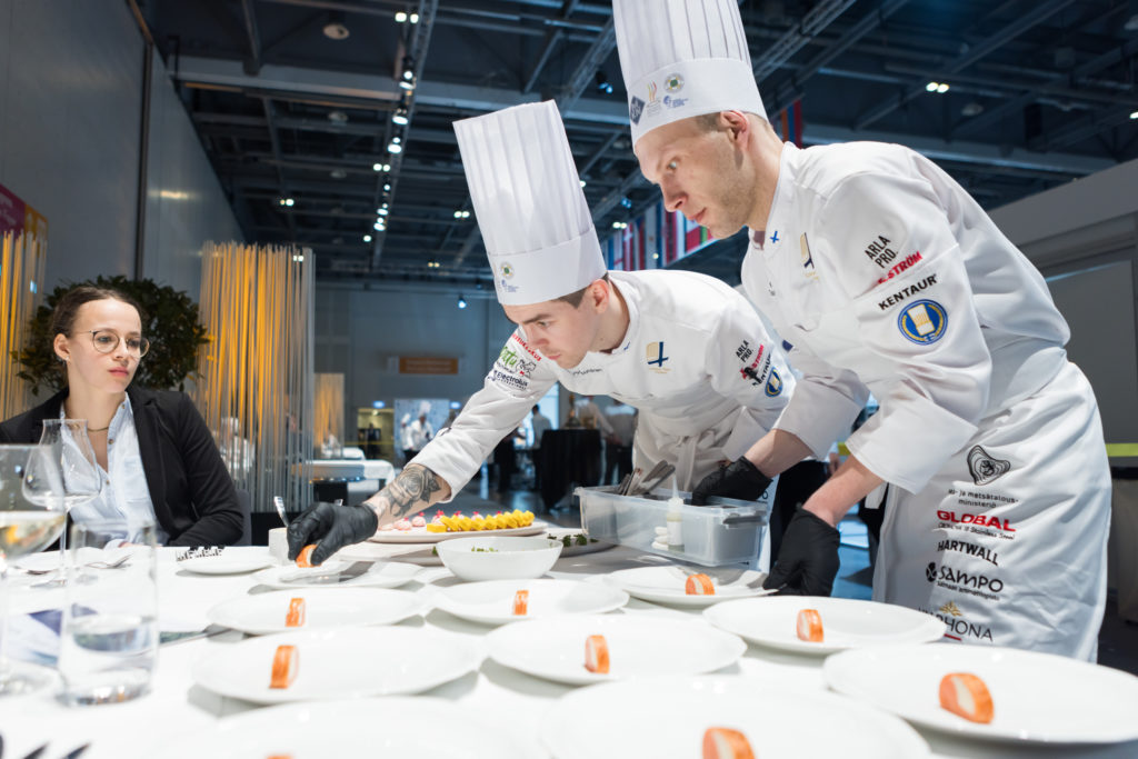 At the Chef's Table, the team members serve the guests.